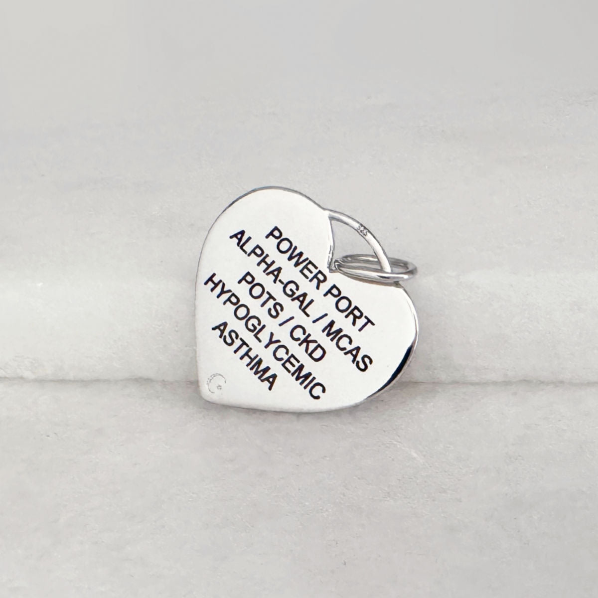 Heart Shaped Medical ID for Women, Sterling Silver & Garnet, Sample of Personalized, Custom Engraving, from CHARMED Medical Jewelry