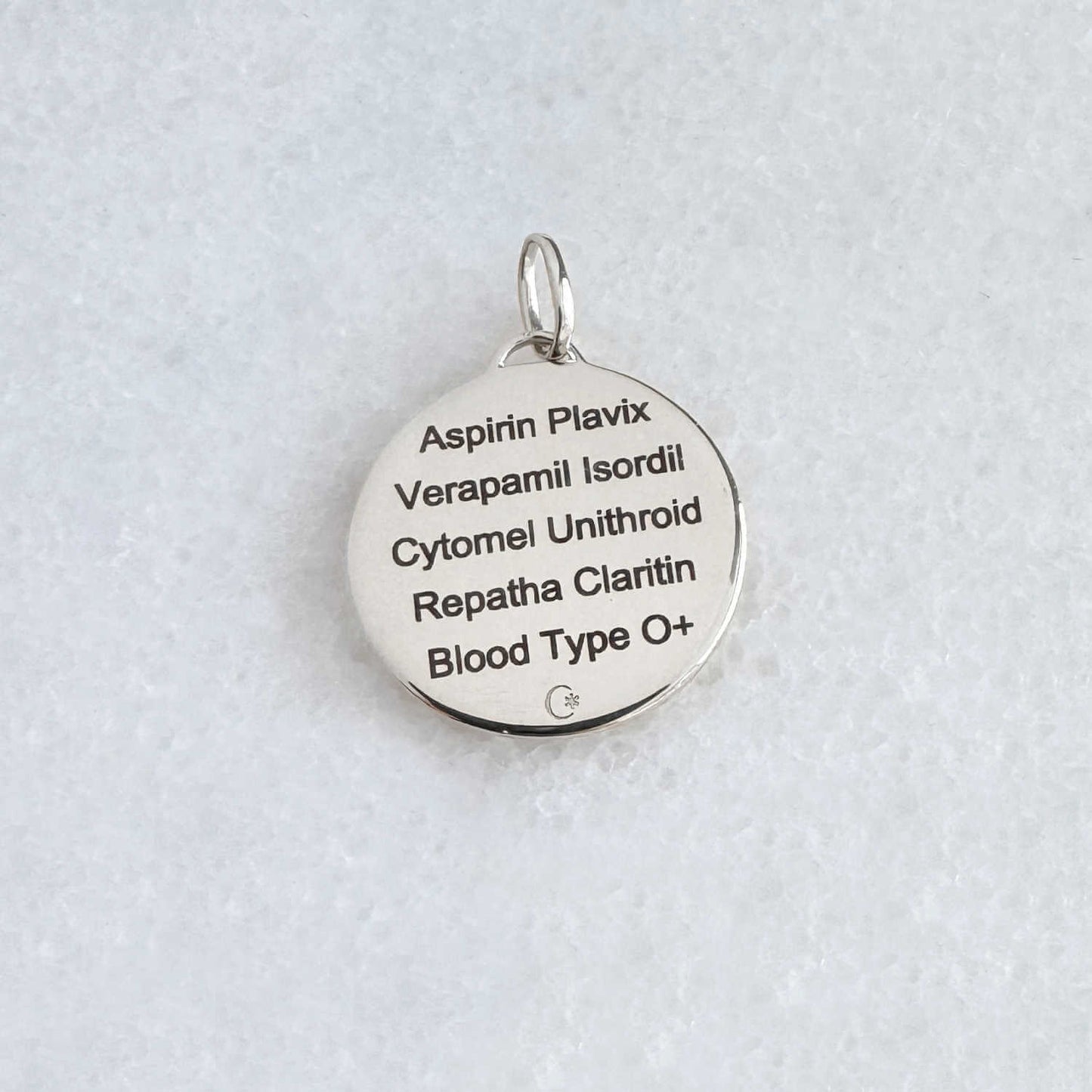 White Gold Medical ID with personalized engraving shown on the back side