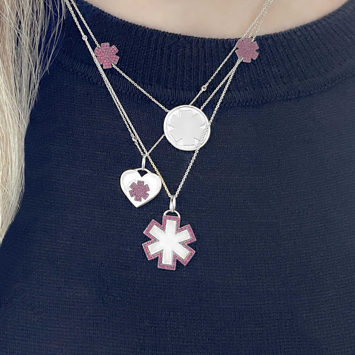 Woman wearing 14k white gold and ruby personalized medical ID necklaces