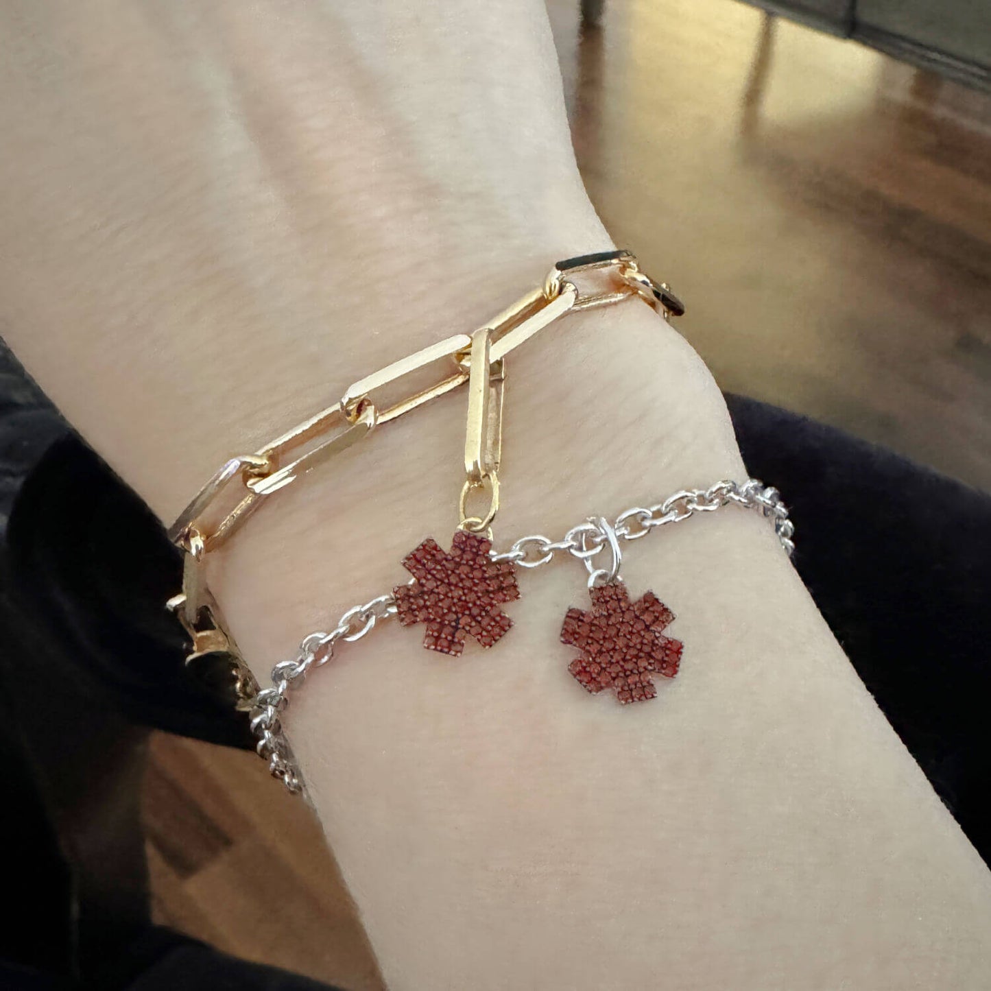 Woman Wearing Star of Life Medical ID Bracelets. Custom Engraved Sterling Silver Medical Alert Jewelry with Garnets
