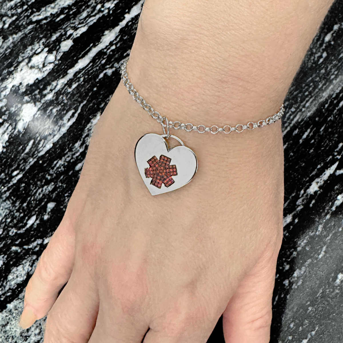 Woman Wearing Medical ID Heart Bracelet, 925 Sterling Silver Medical Alert with Garnets and Personalized Engraving