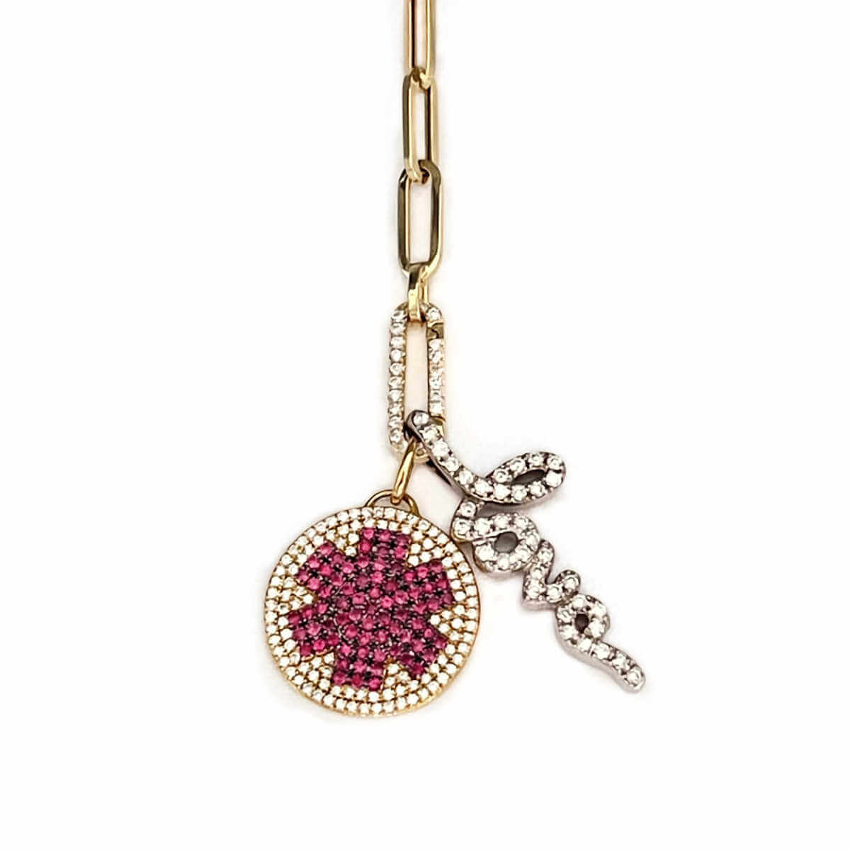 Diamond medical ID charm styled on a necklace with charm holder and diamond love charm