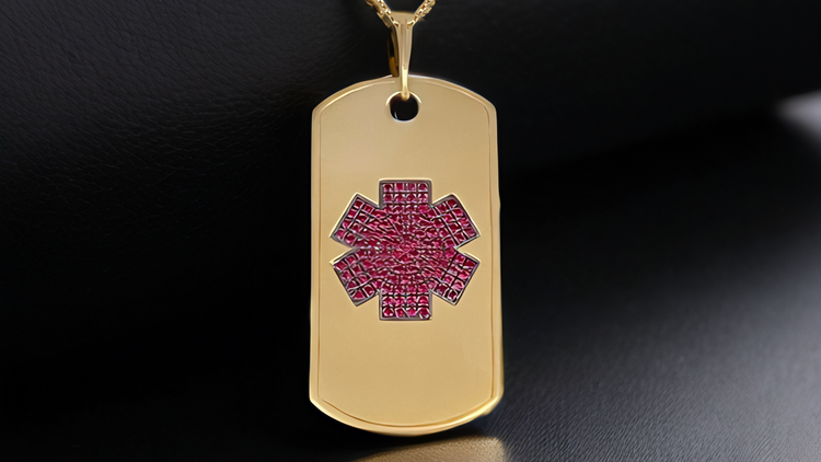 Gold necklace with a medical alert DOG tag on a dark surface