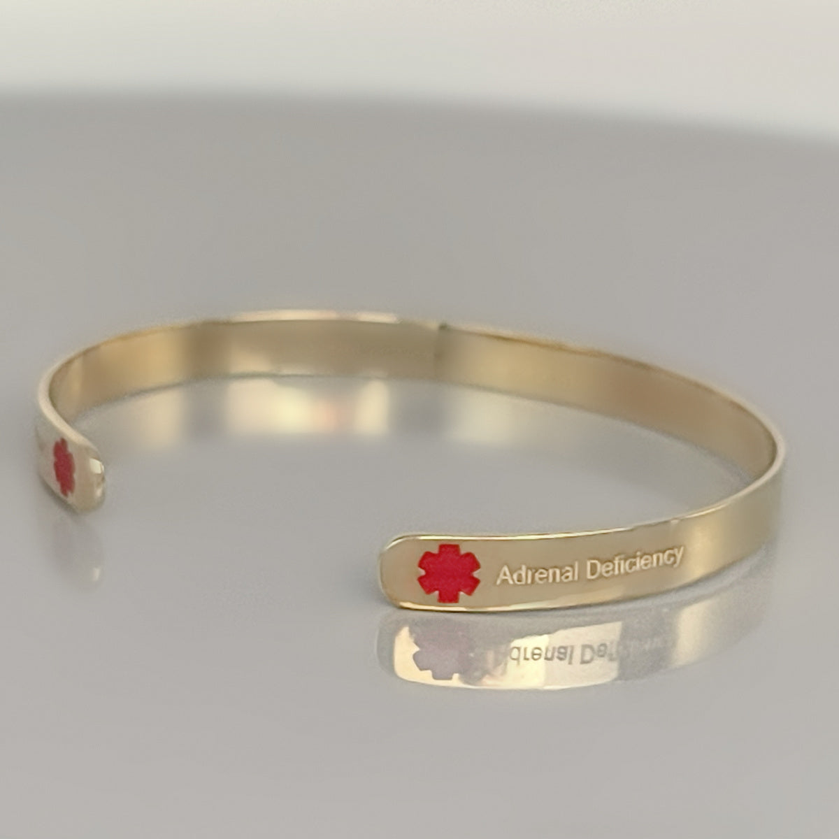 Gold Medical Alert Cuff Bracelet with Red Enamel | 14K Custom Engraved Medical ID | CHARMED Medical Jewelry