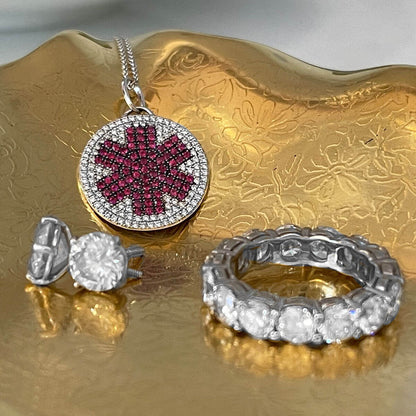 Diamond medical ID necklace in gold jewelry tray with woman's diamond jewelry