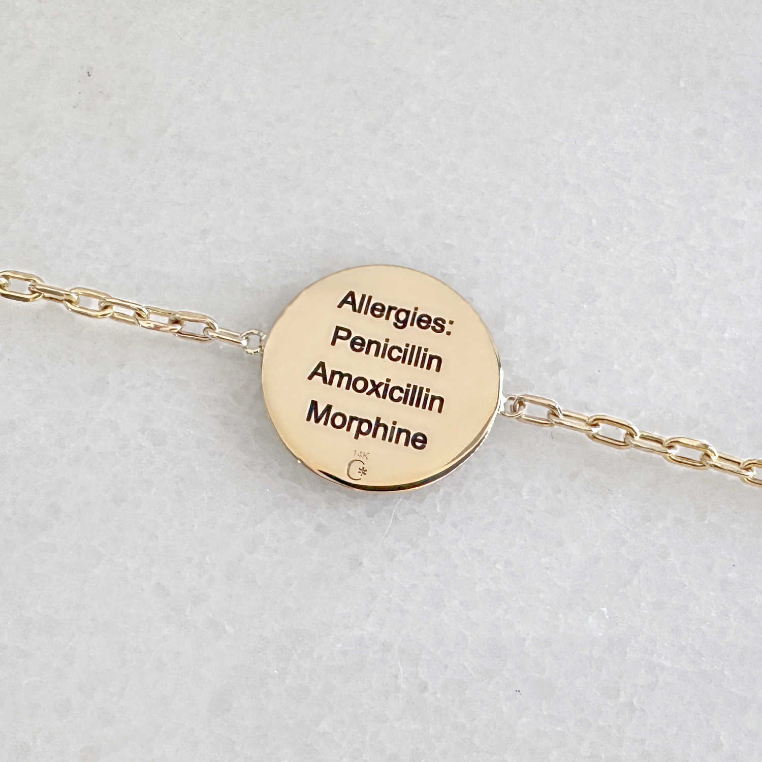 Gold Medical ID bracelet with personalized engraving shown on the back side
