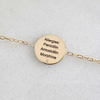 Gold Medical ID bracelet with personalized engraving shown on the back side