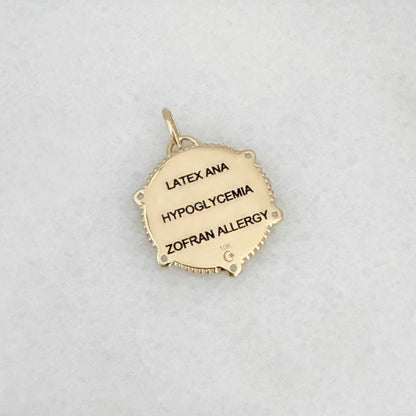 Gold Medical ID Medallion charm with personalized engraving shown on the back side