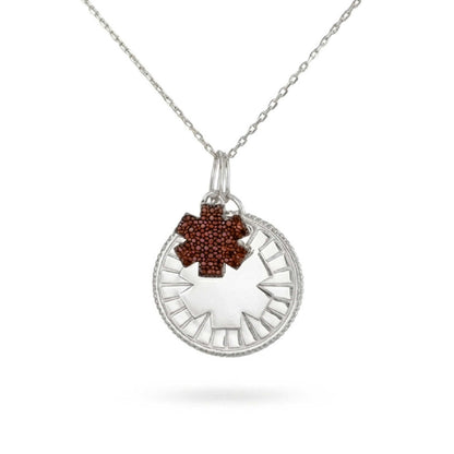 A sterling silver medical ID medallion necklace with a garnet jeweled star of life accent charm attached to a silver cable chain.