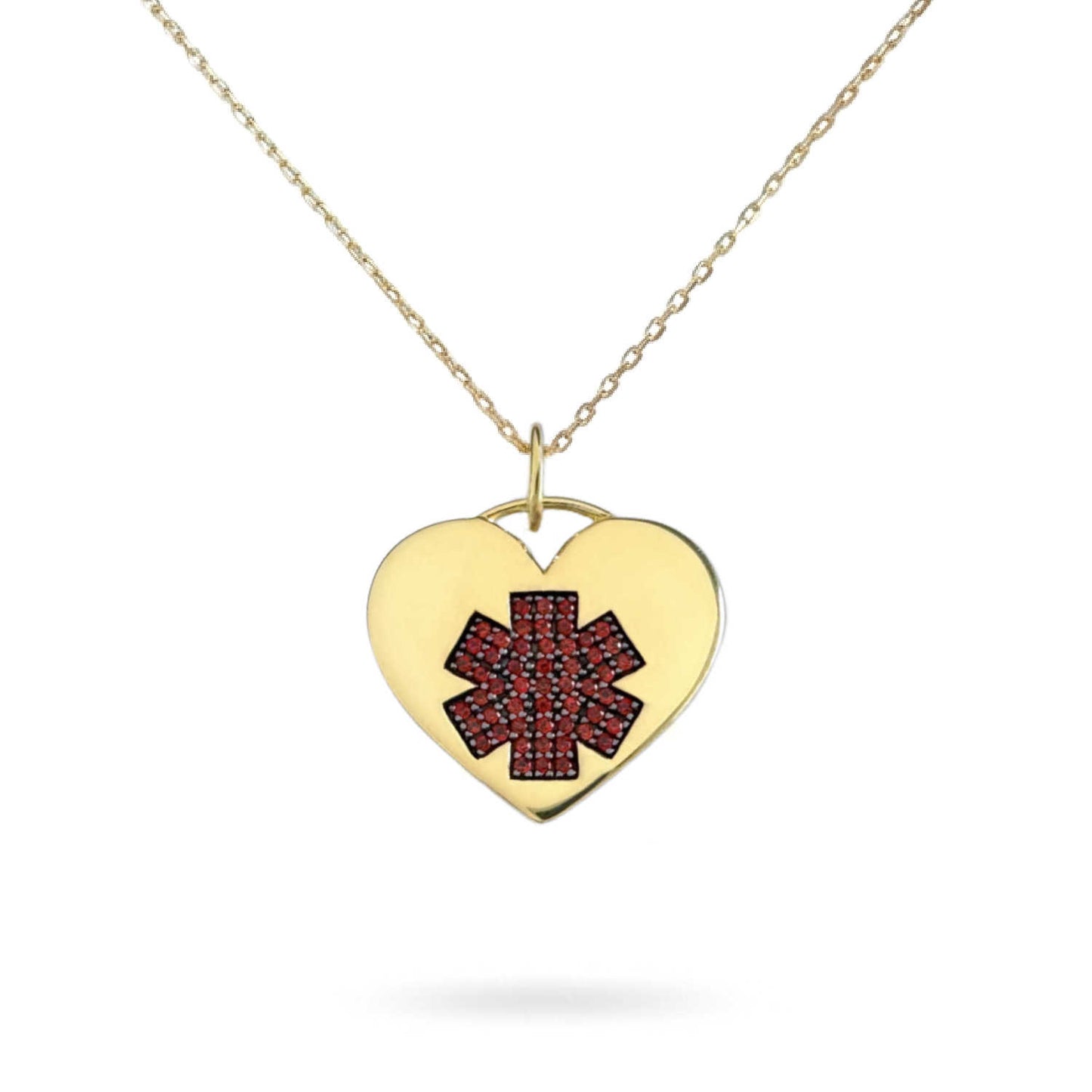 A gold heart-shaped medical ID pendant necklace featuring a red Star of Life design on the front, suspended from a delicate gold chain against a white background.