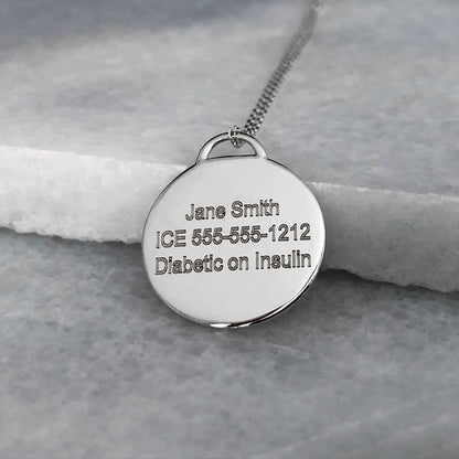 White Gold Medical ID with personalized engraving shown on the back side