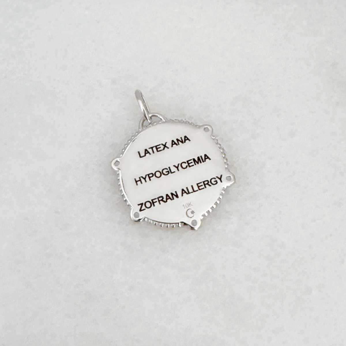 White Gold Medical ID Medallion charm with personalized engraving shown on the back side