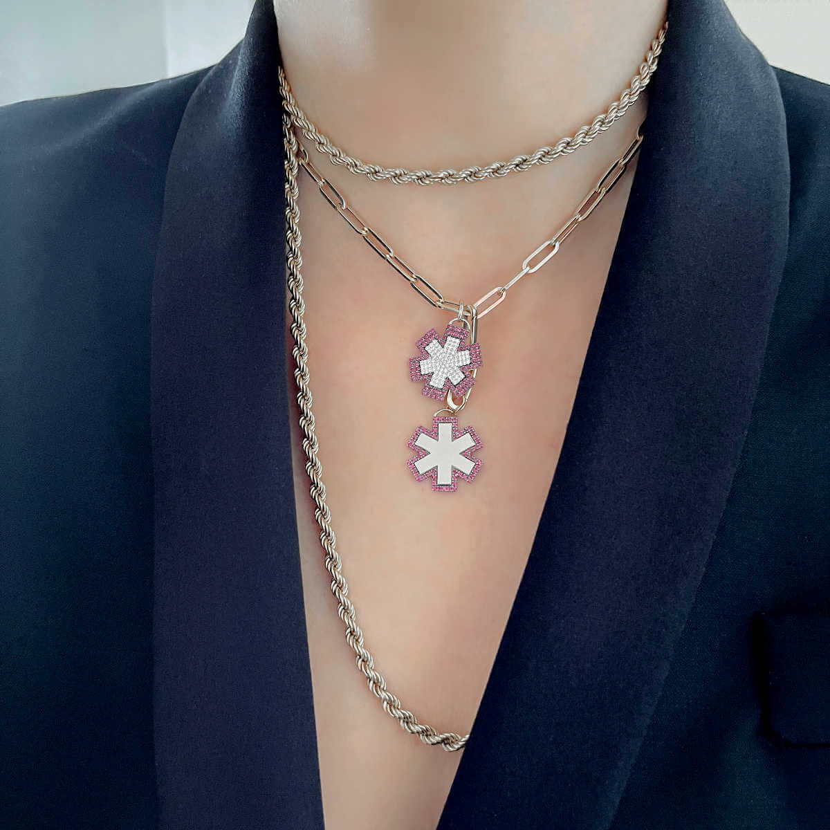 Woman Wearing Medical ID Charm Necklaces, 14k Gold Medical Alerts with Diamonds, Rubies, and Personalized Engraving