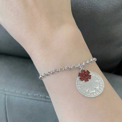 Woman Wearing Sterling Silver and Garnet Medical ID Bracelet with Personalized Engraving