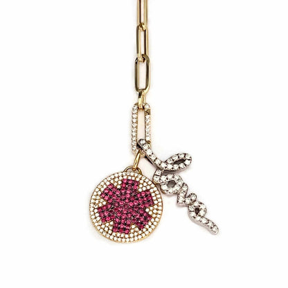 Diamond medical ID charm styled on a necklace with charm holder and diamond love charm