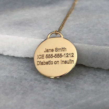 Gold Medical ID with personalized engraving shown on the back side