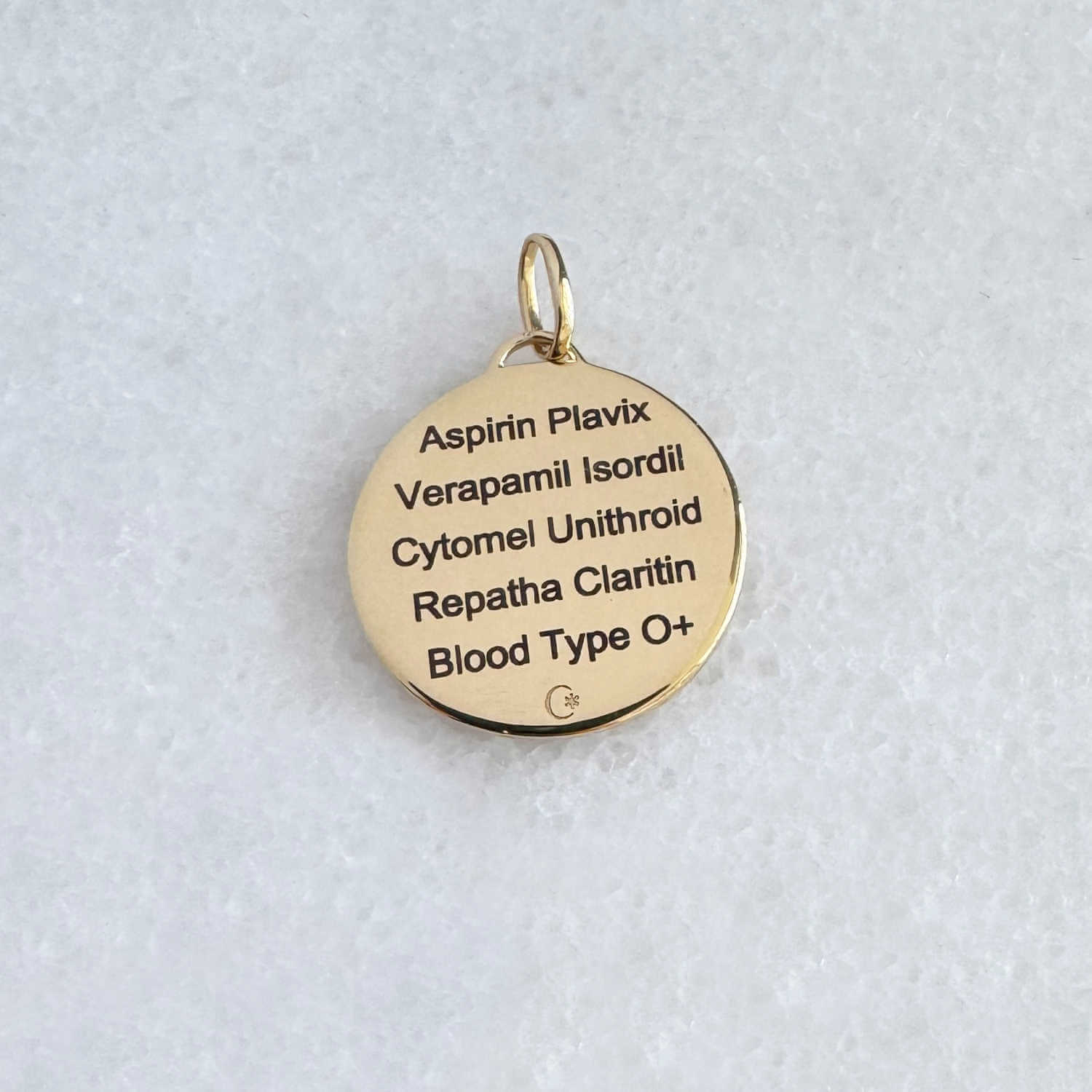 Gold Medical ID with personalized engraving shown on the back side