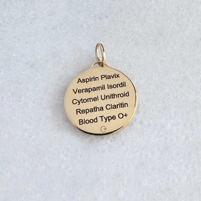 Gold Medical ID with personalized engraving shown on the back side