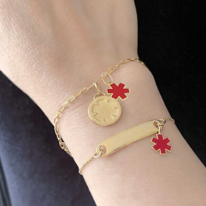 Woman Wearing 2 Medical ID Bracelets. Custom Engraved 14k Gold Medical Alert Jewelry with Rrd Enamel Star of Life
