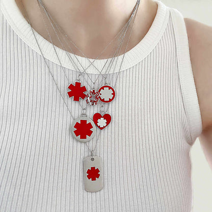 Woman wearing medical ID charm necklaces, white gold medical alert jewelry with  personalized engraving